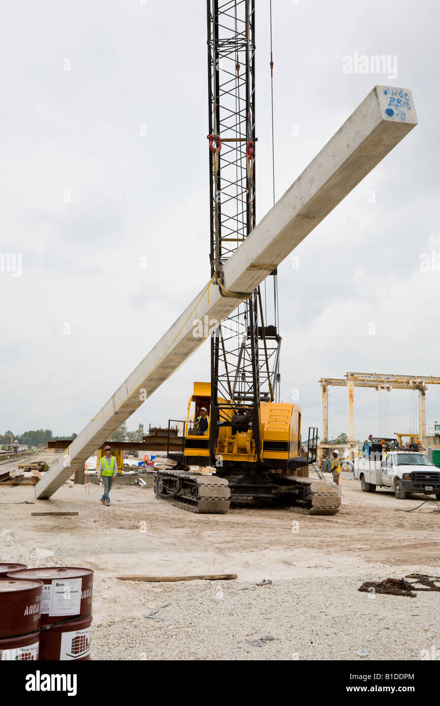 Crane lifting prestressed precast concrete pile Stock Photo