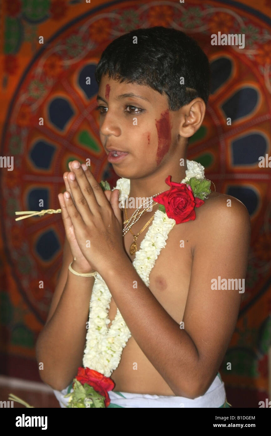 Young Hindu boy prays during his Upanayanam or Sacred thread ceremony