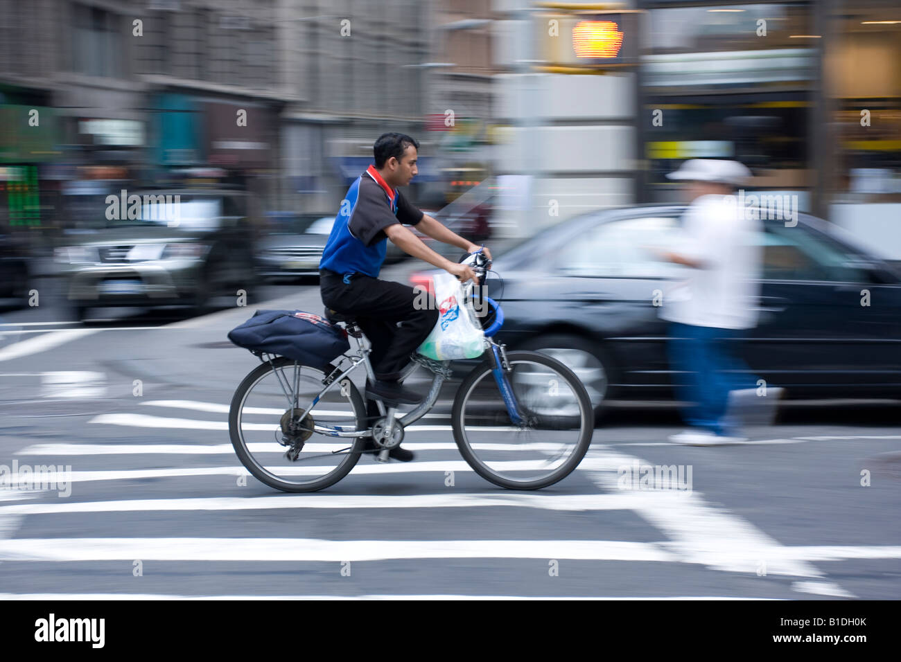 A pizza delivery person in Manhattan, NY Stock Photo