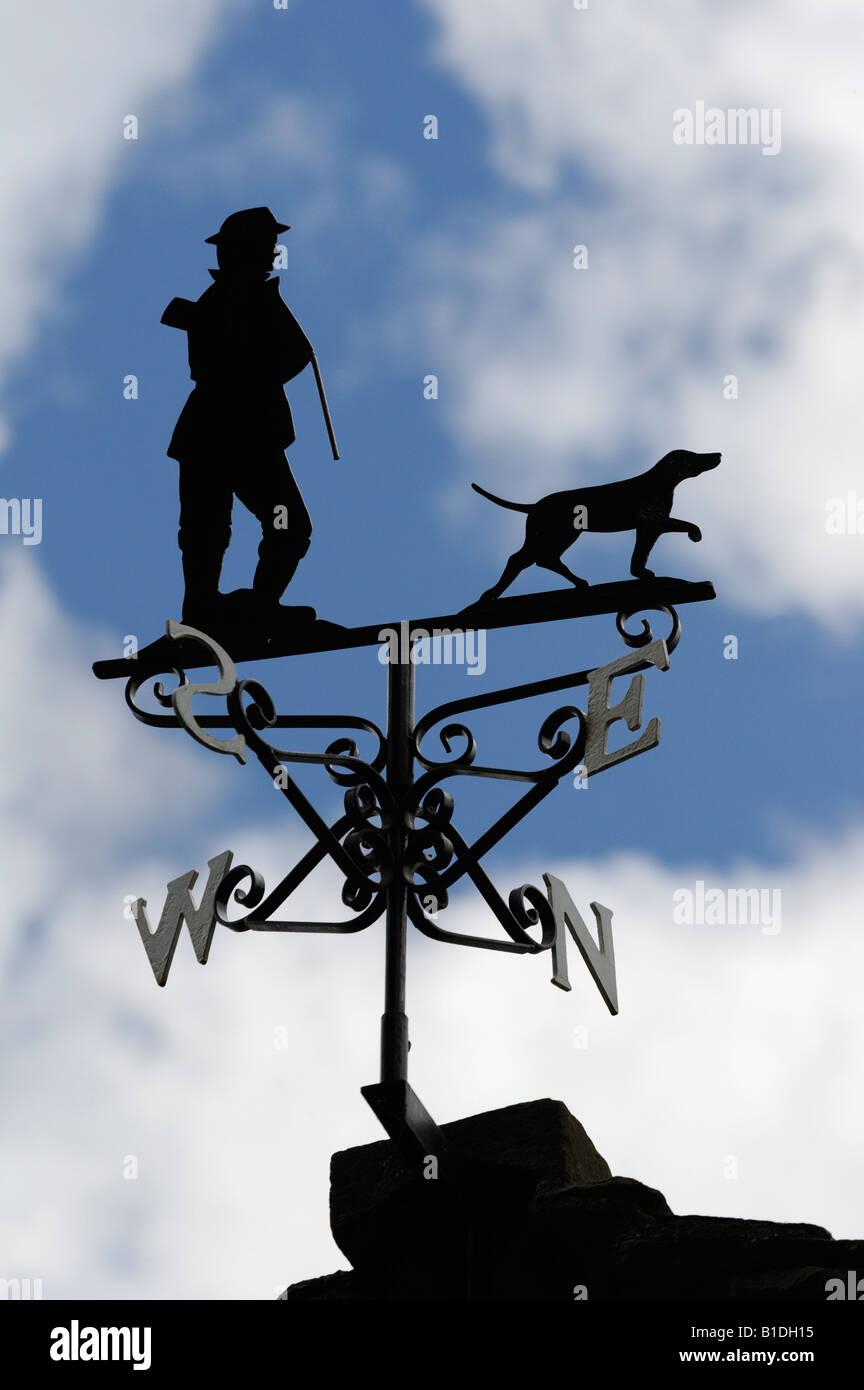 Farmer with shotgun and retriever dog, weathervane. Arkholme, Lancashire, England, United Kingdom, Europe. Stock Photo