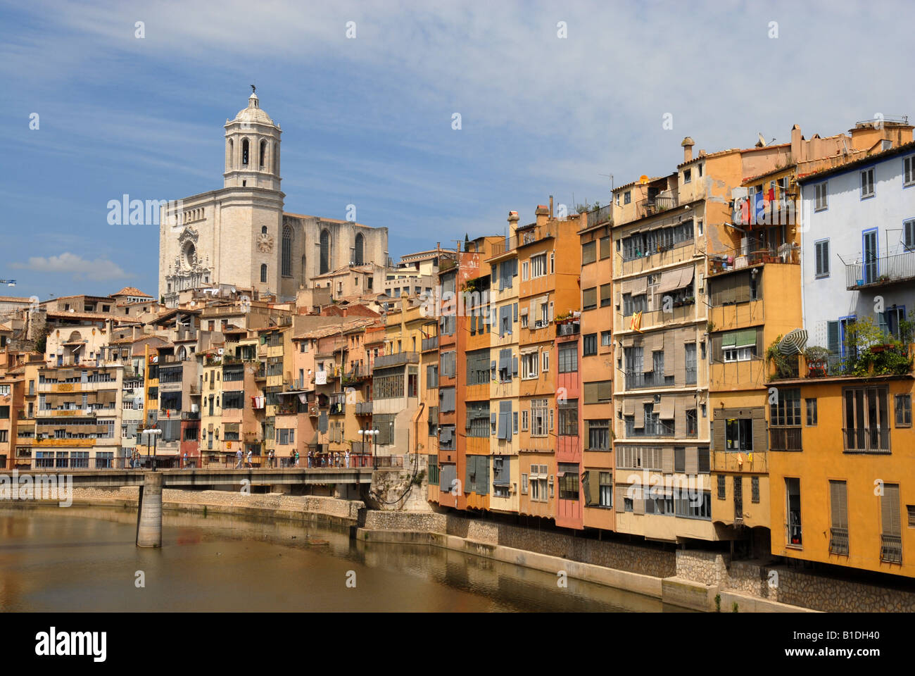 City apartments overlooking the River Onyar with the Cathedral dominating the sky in Girona Spain Europe Stock Photo