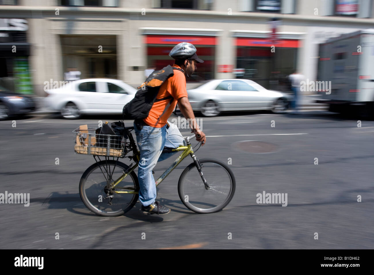 A bike messenger on Broadway in lower Manhattan, NY Stock Photo