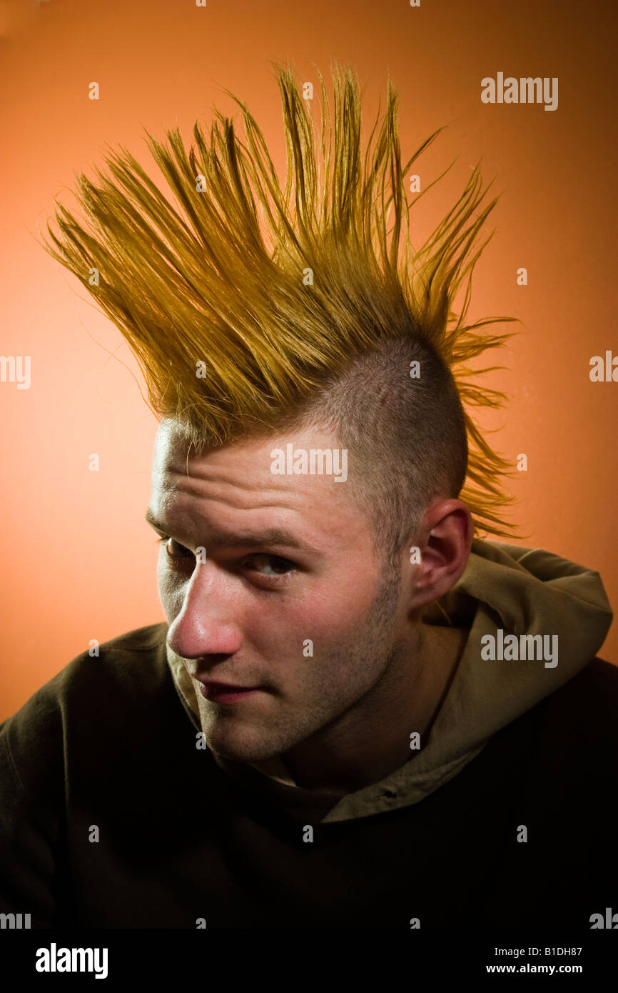 Young man with a Mohawk hairdo posing MODEL RELEASED Stock Photo