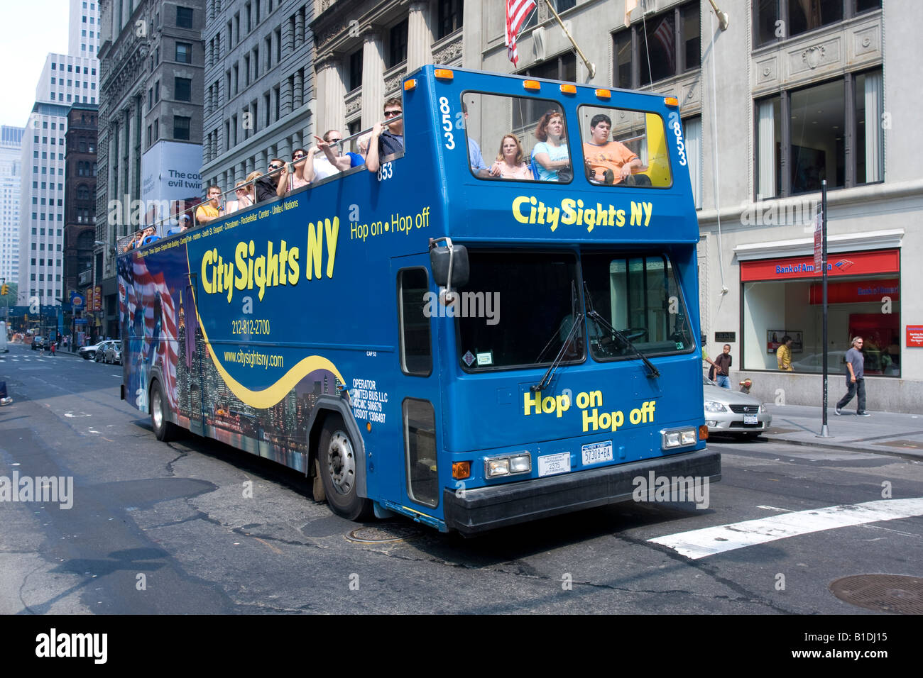 A City Sights NY tour bus on Broadway in Lower Manhattan, NY. Stock Photo