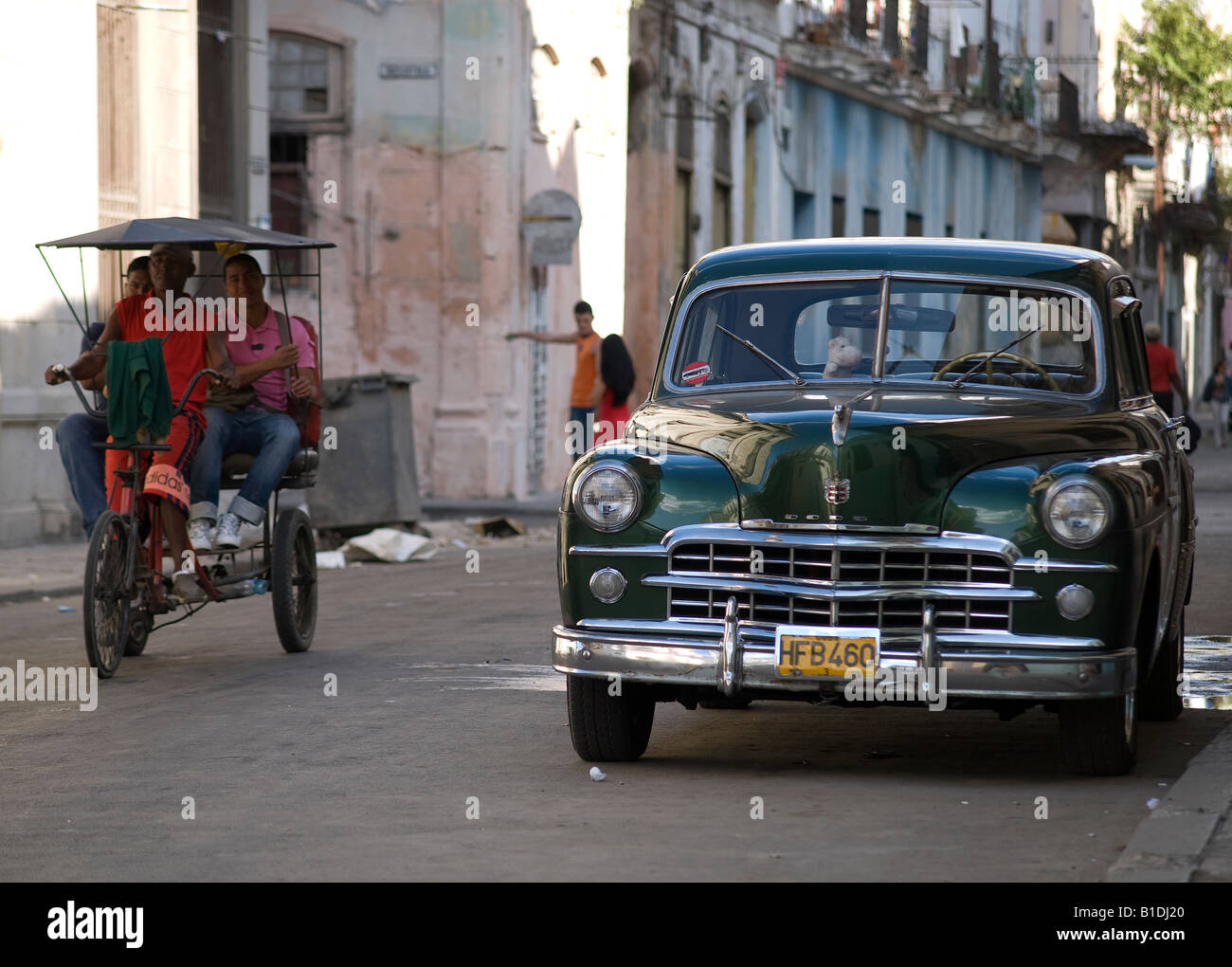Old american car and bicitaxi in Habana Centro Stock Photo