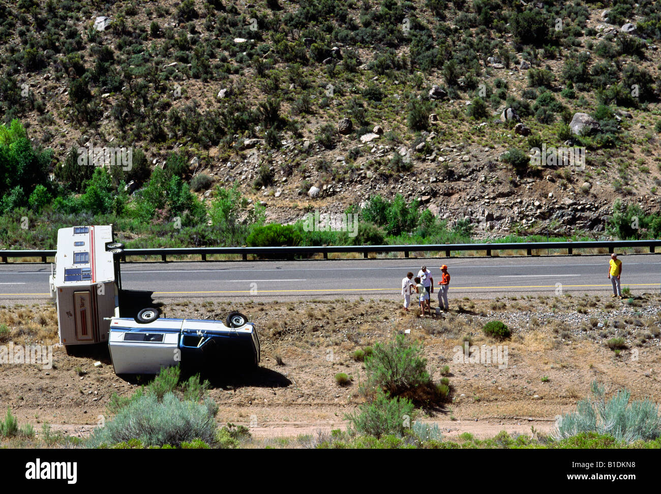 An overturned vehicle on the Interstate highway in New Mexico Stock