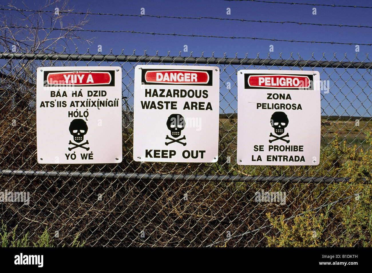 Hazardous waste warning signs in English, Spanish and Navajo in New