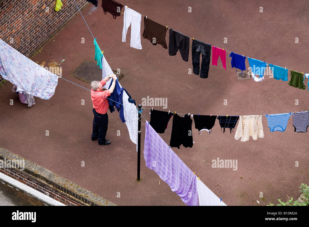 Man putting the laundry to dry London England Britain Uk Stock Photo