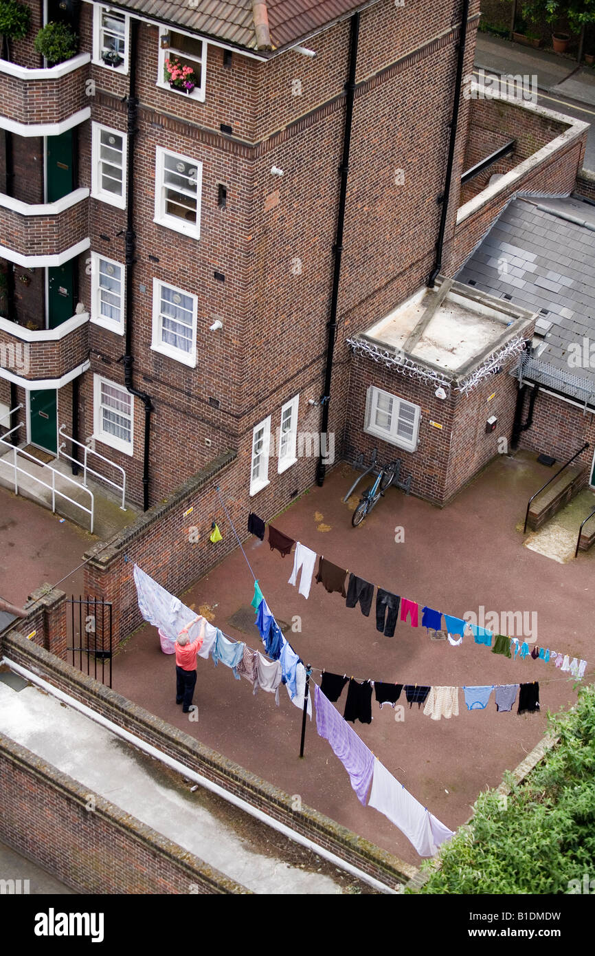 Lines of clothes out to dry in a council estate London England Britain Uk Stock Photo