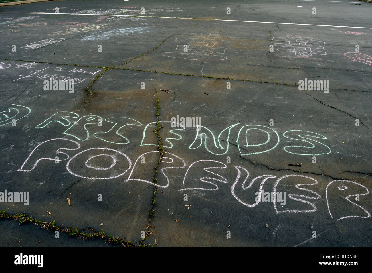 Chalk graffiti in a parking lot Stock Photo Alamy