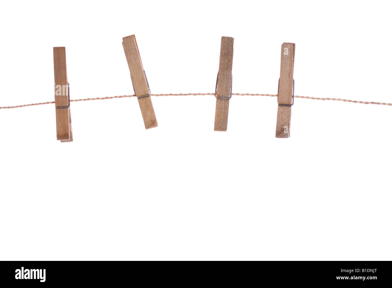 three clothespins on rope isolated Stock Photo Alamy