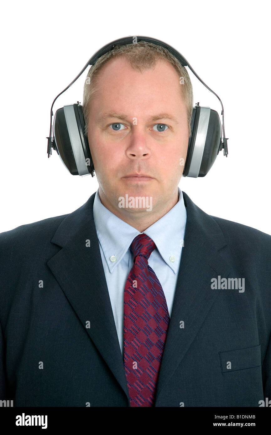 Head and shoulders shot of a businessman wearing ear defenders