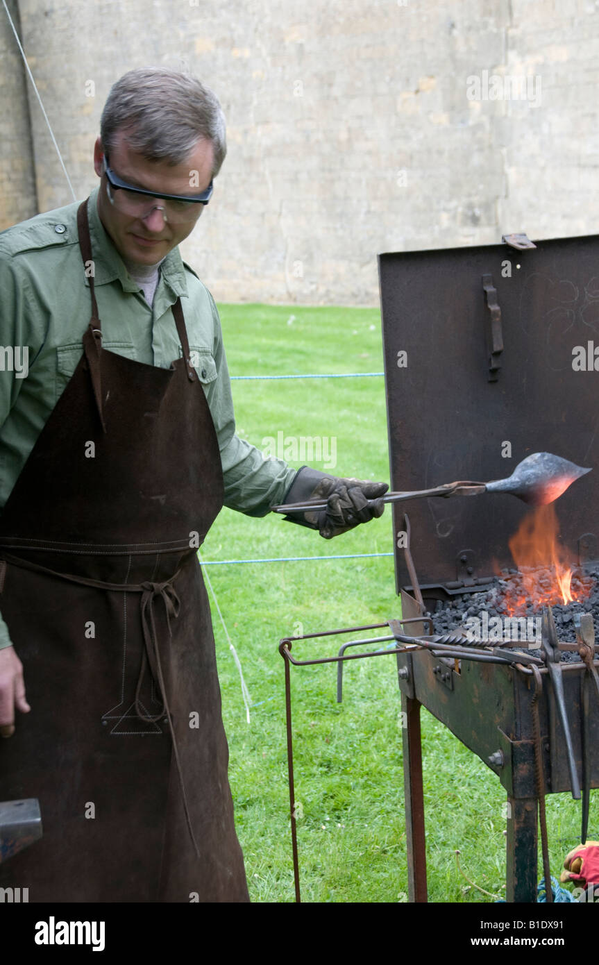 Blacksmith with at craft fair Derbyshire England Stock Photo Alamy