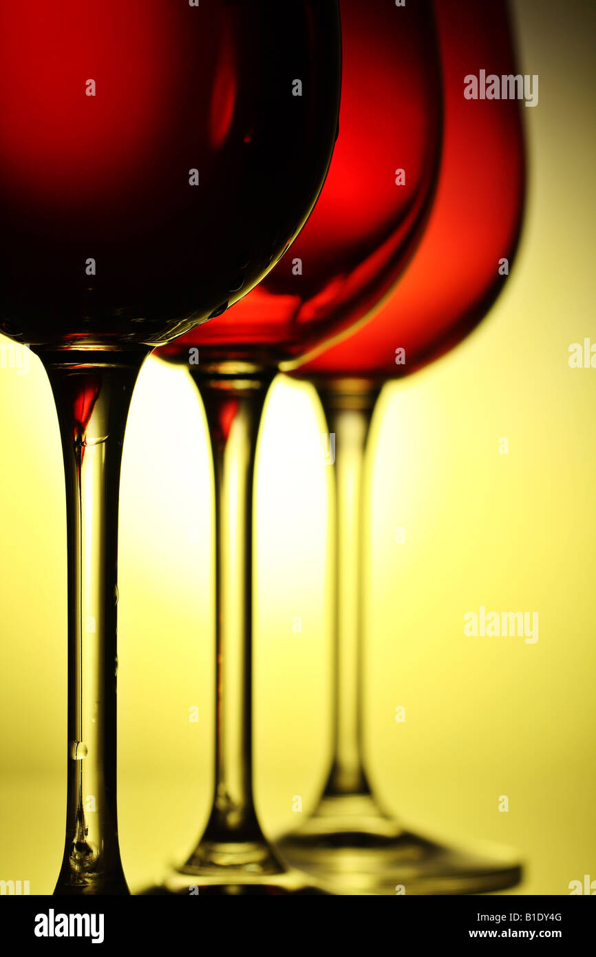 three beautiful red wine glasses with a drip of wine running down the glass Stock Photo Alamy
