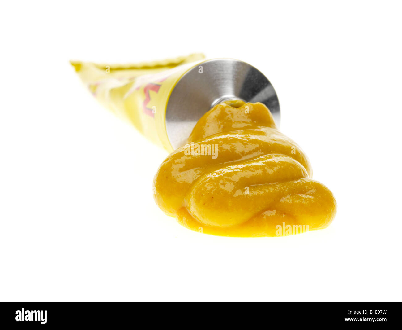 Tube Of Traditional Spicy Yellow English Mustard Isolated Against A