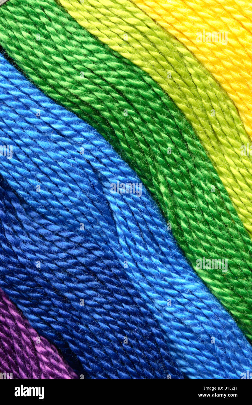 Diagonal of brightly coloured craft yarn Stock Photo