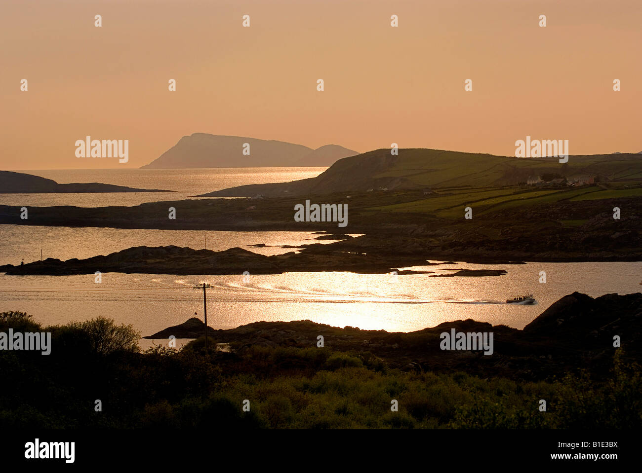 Sunset looking towards Scarrif & Deenish islsnds over Derrynane bay Ring of Kerry from Beara Peninsula Kerry Ireland Stock Photo