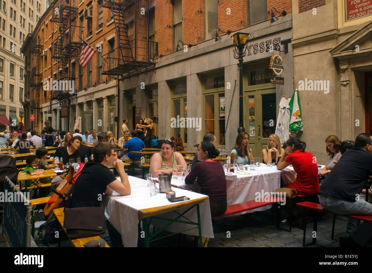 Restaurants on Stone Street in Lower Manhattan extend into the closed street Stock Photo