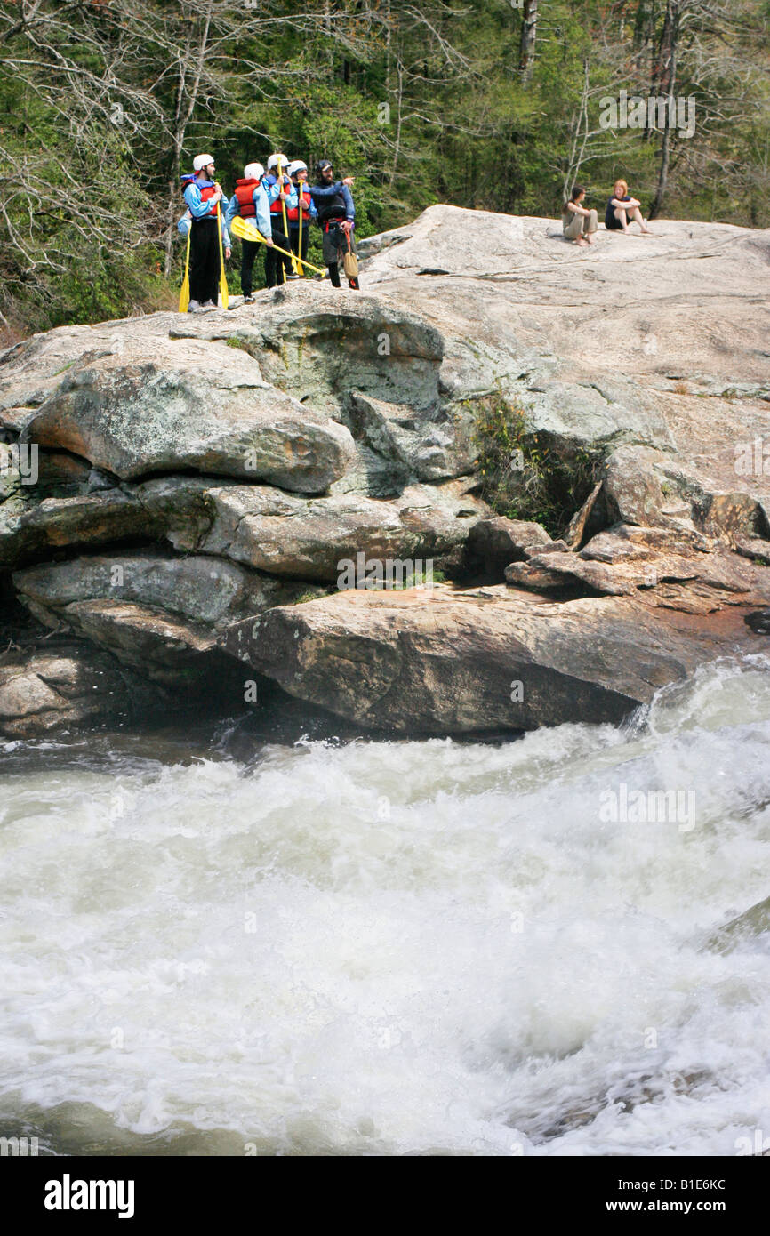 A family of whitewater rafters checks out the Bull Sluce on the Chattooga River between South Carolina and Georgia Stock Photo