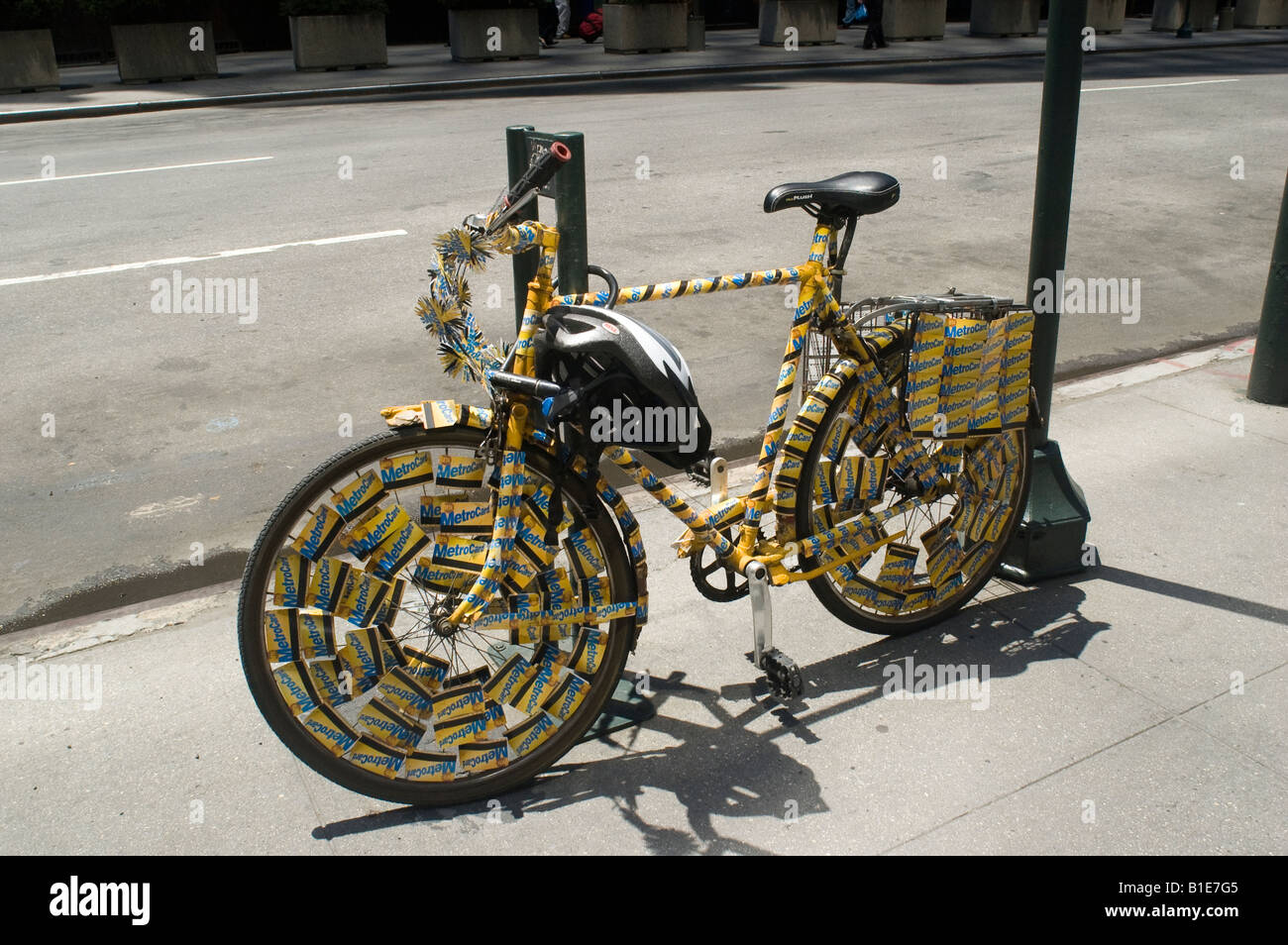 An advocate of alternative transportation decorates their bicycle with used Metroplitan Transit Authority Metrocards Stock Photo