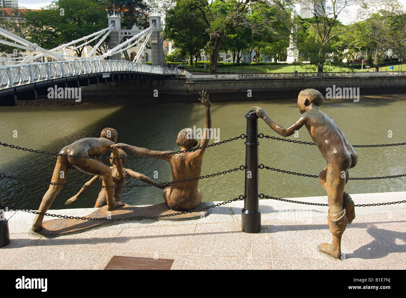 First Generation, a Sculpture of Five Boys Leaping into the Singapore River near Cavenagh Bridge in Singapore Stock Photo