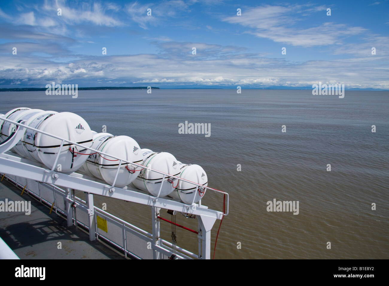 Inflatable liferafts in hard-shelled canister on a passenger ferry Stock Photo