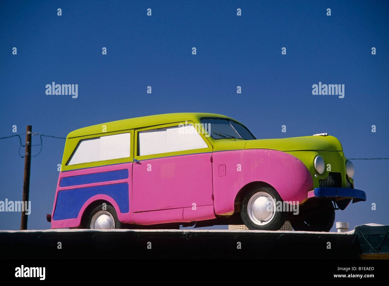 Colorful old car atop building USA Summer Stock Photo