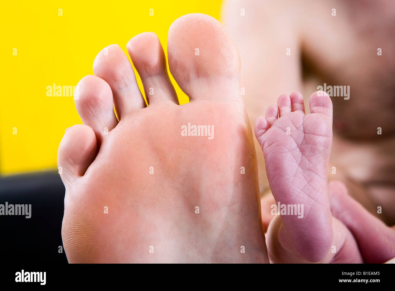 Newborn infant's foot placed in front 