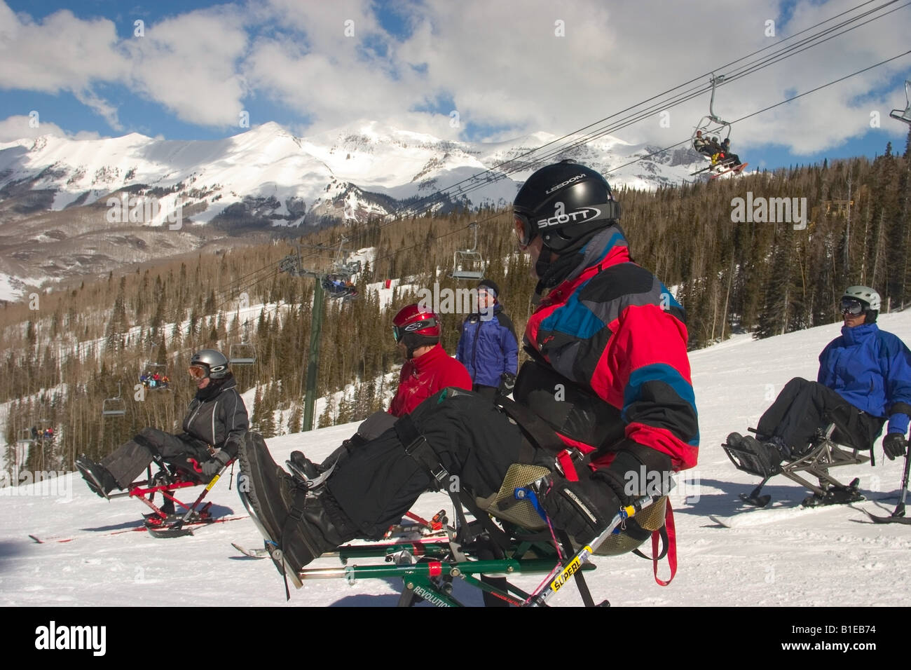 Mono-skiers listen to instruction from Professional Ski Instructor in Telluride Colorodo Stock Photo