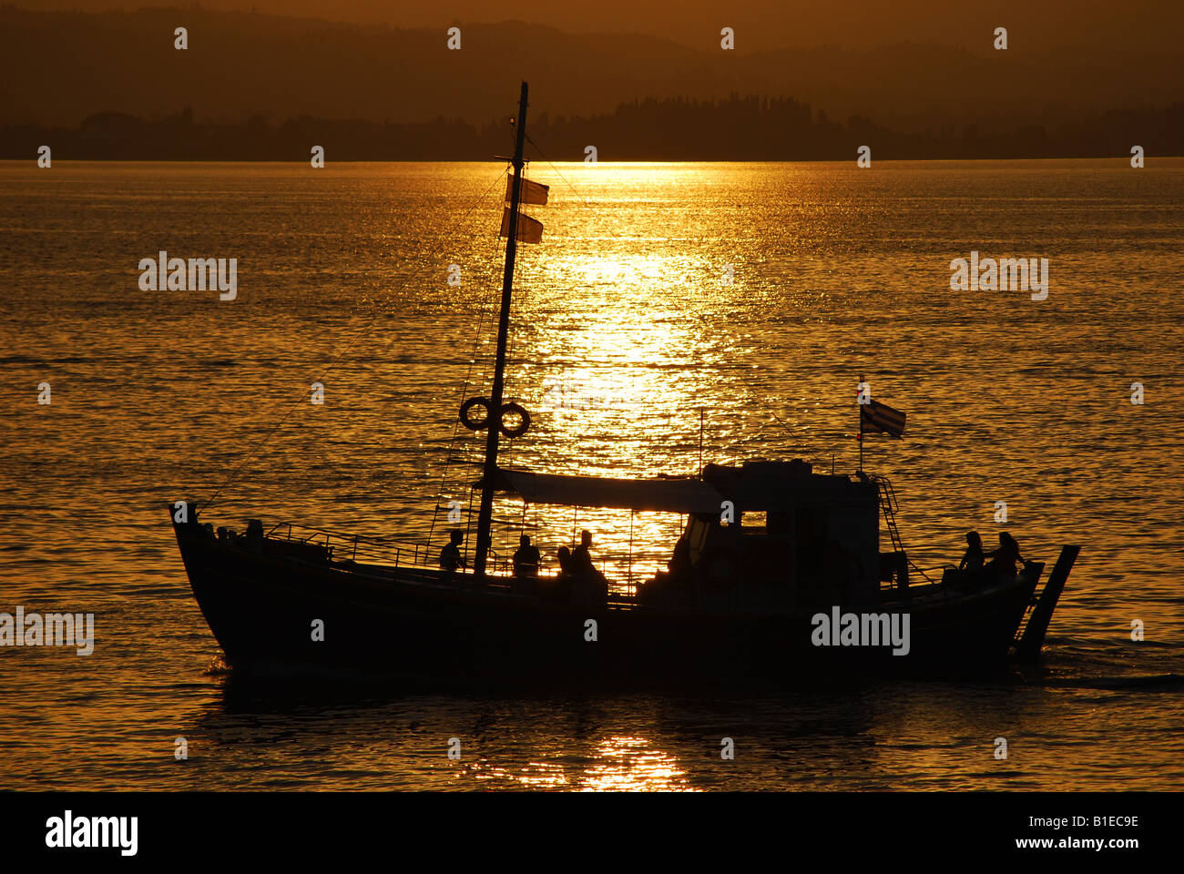 A small boat in the sunset Stock Photo