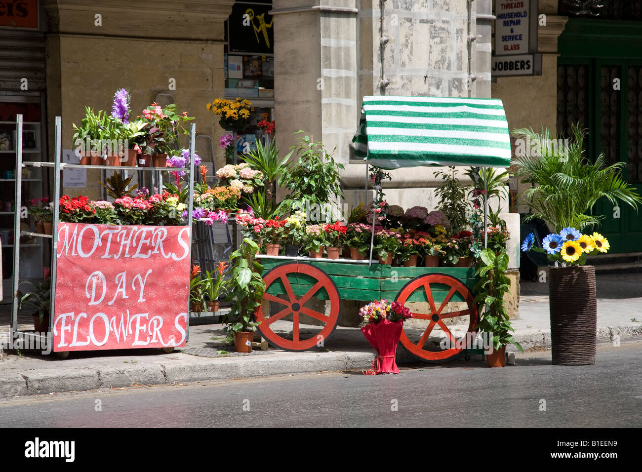 Mothers Day Flowers, blooms for sale, green flower cart with red wheels