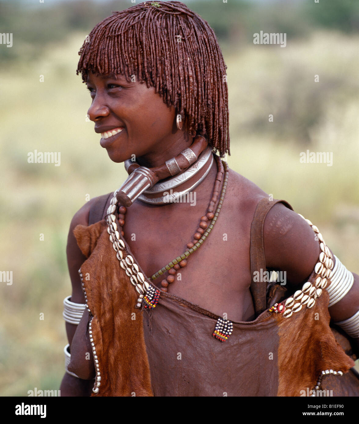 A Hamar woman of Southwest Ethiopia.  The phallic protrusion of her necklace denotes that she is her husband's first wife. Stock Photo