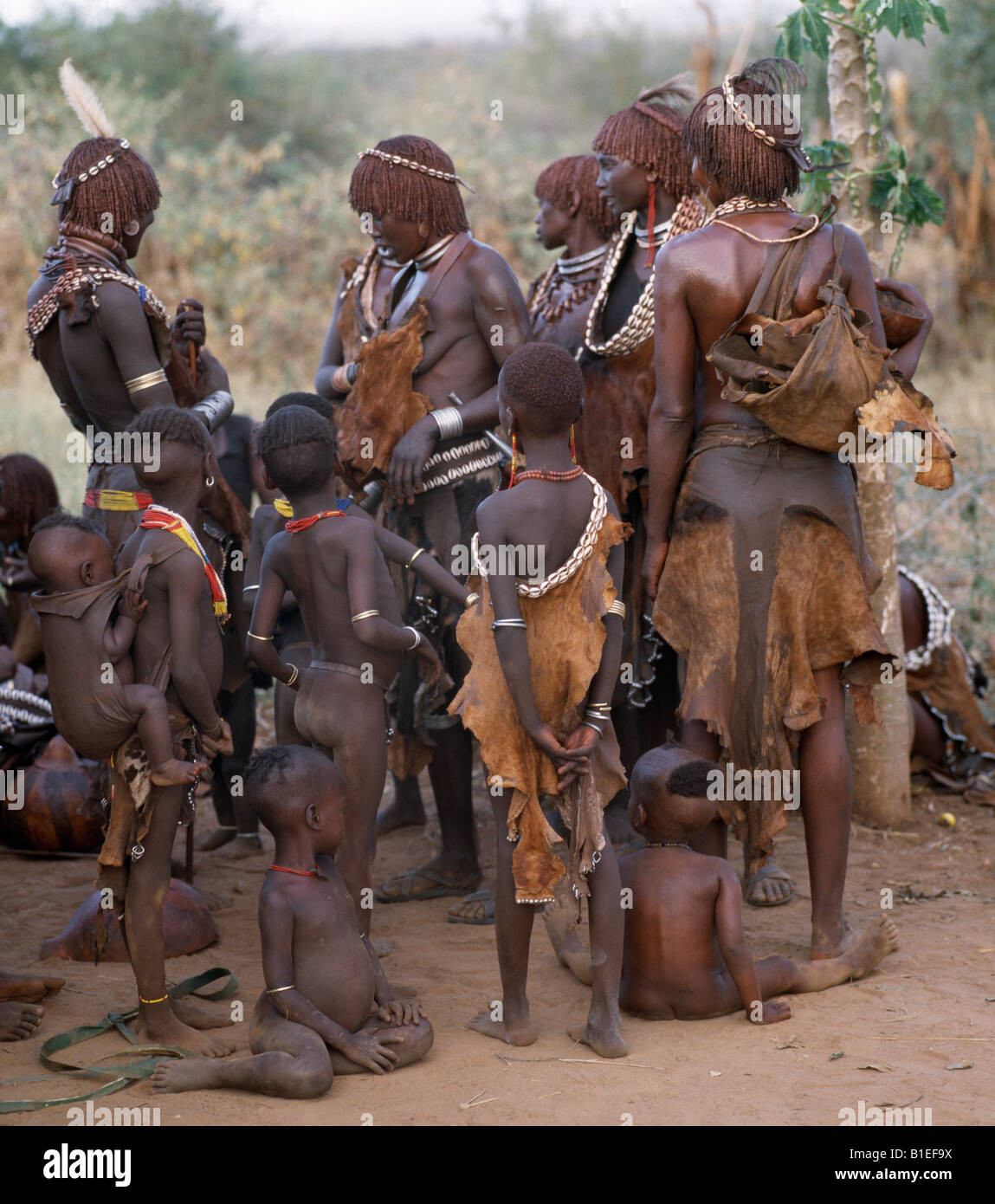 A group of Hamar women and children in traditional dress. The Hamar are semi-nomadic pastoralists. Stock Photo