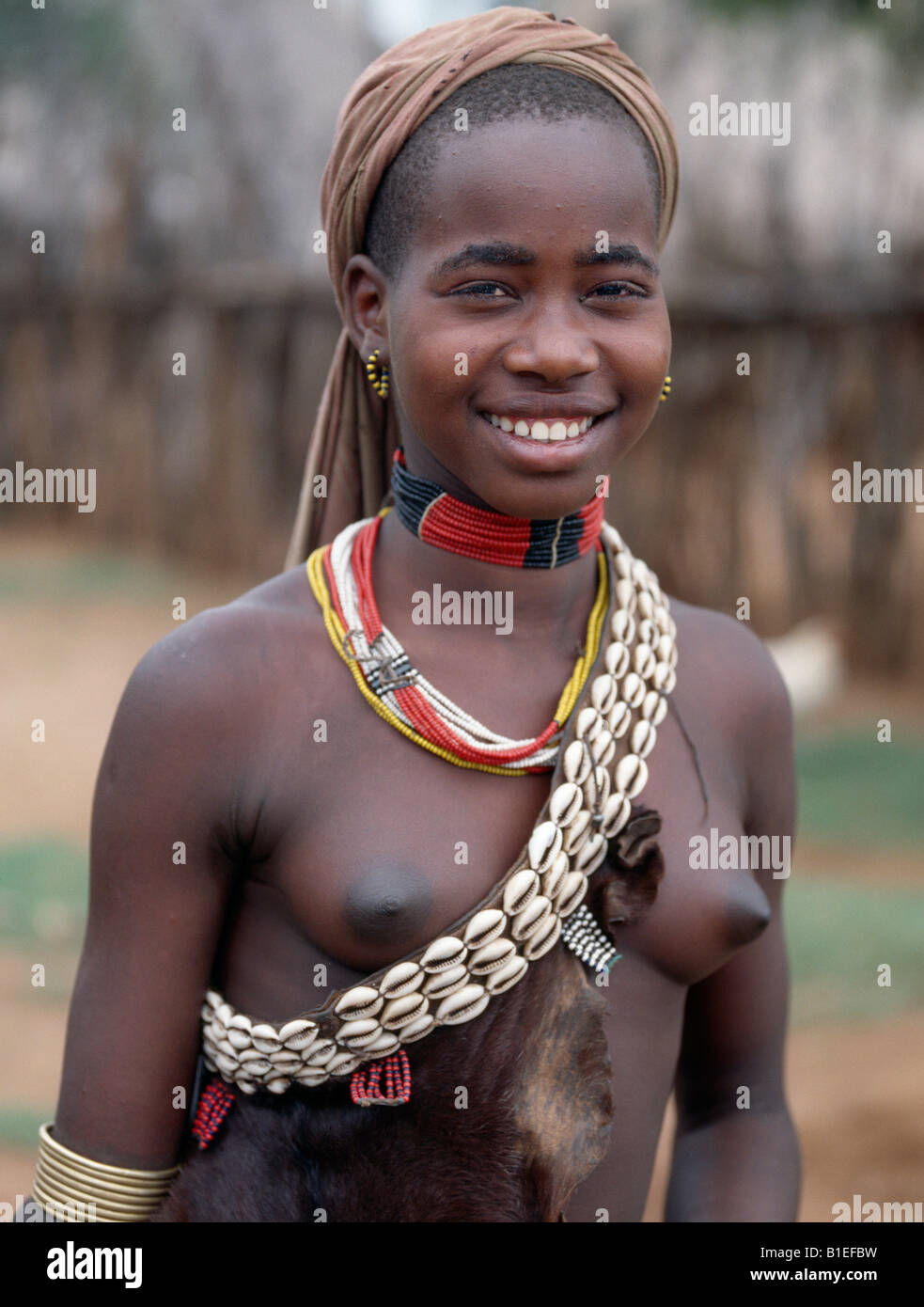 An attractive Hamar girl on her way to Dimeka, the largest market in the Hamar country of Southwest Ethiopia. Stock Photo