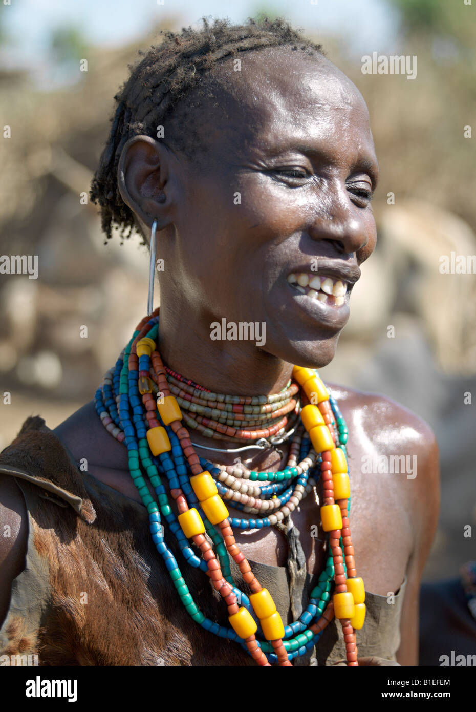 A Dassanech woman in jovial mood. The Dassanech speak a language of Eastern Cushitic origin. They live in the Omo Delta. Stock Photo