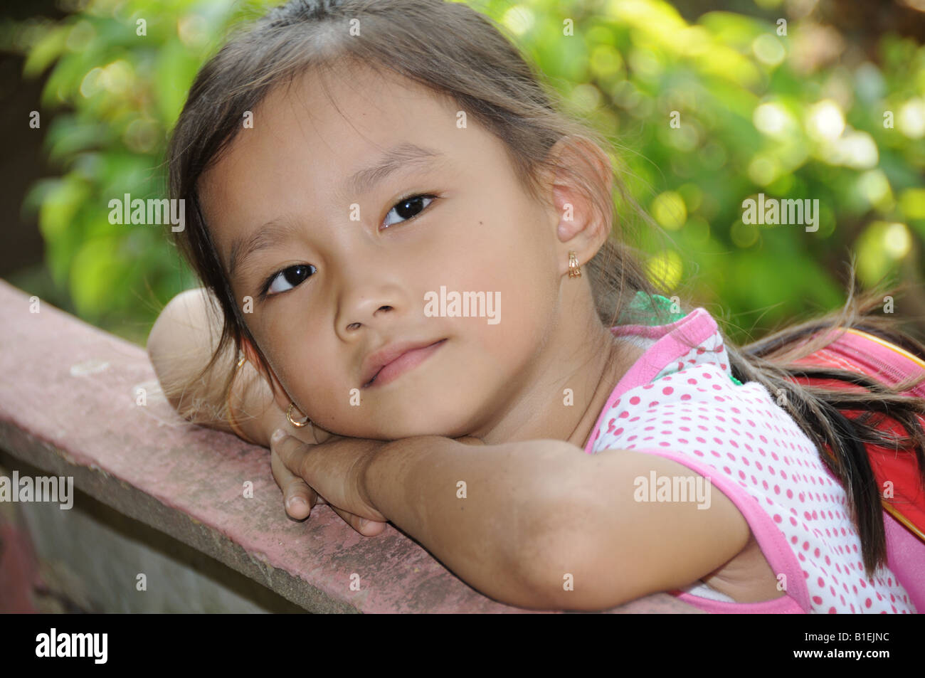 Little Vietnamese girl on her way home from school Cai Be Vietnam Stock ...