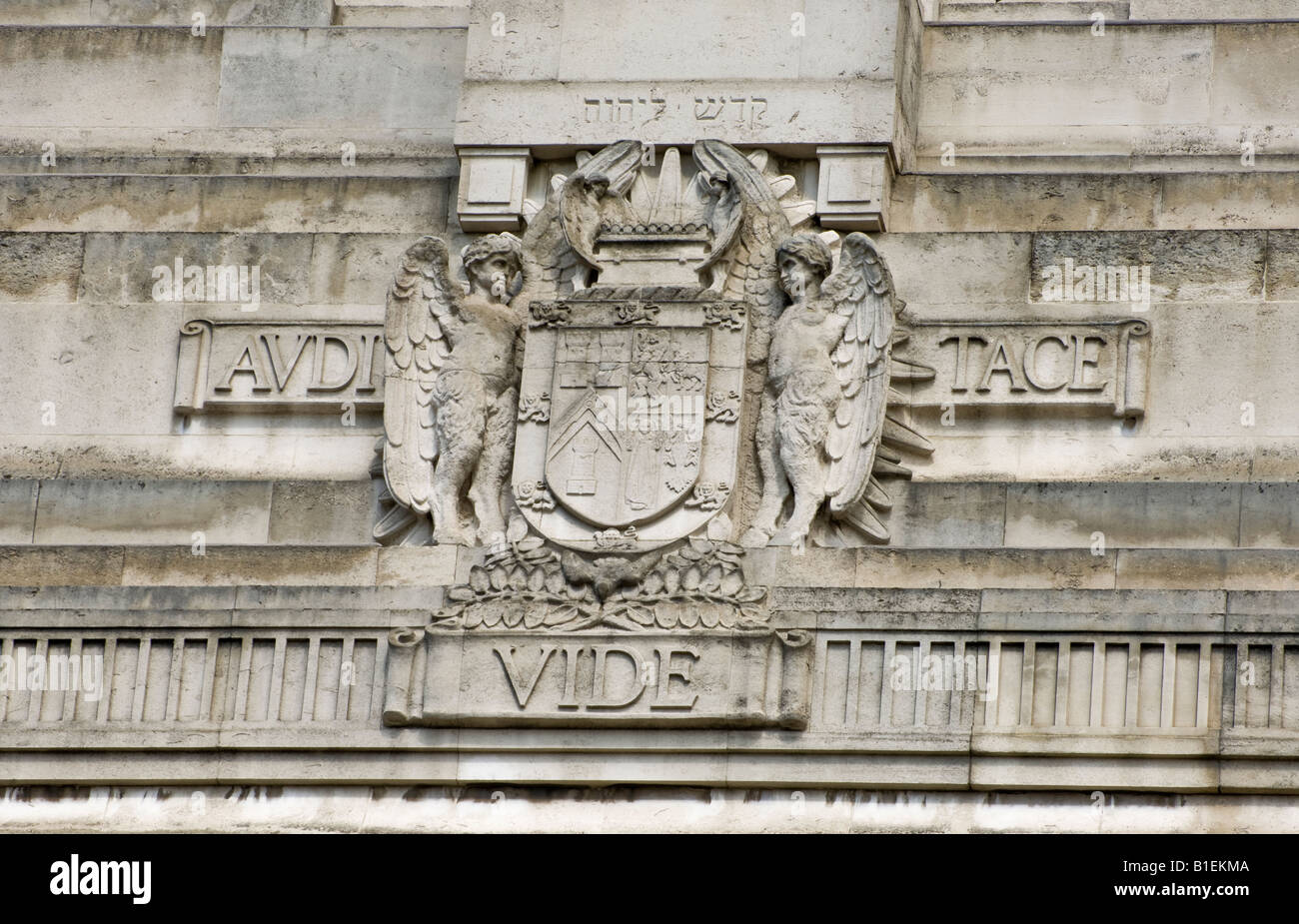 The Coat of Arms of the United Grand Lodge of England sculpted in stone on the facade of the Freemasons' Hall. Stock Photo