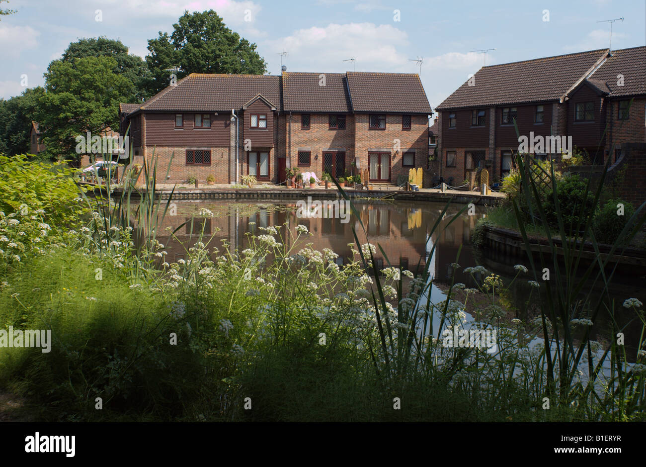 Water side apartment flats on the Basingstoke Canal Woking Surrey England Stock Photo