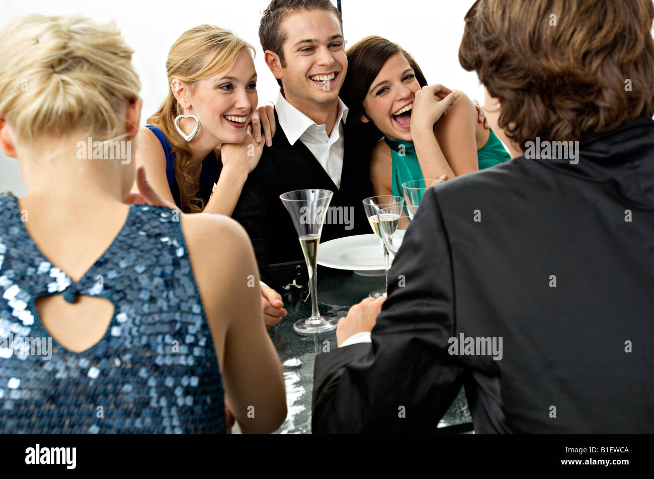 Five people enjoying a dinner party Stock Photo - Alamy