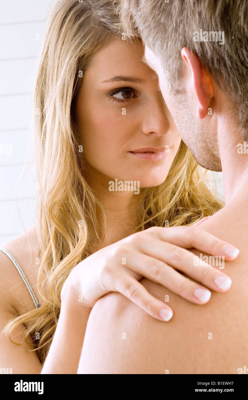 Young woman and a mid adult man romancing Stock Photo - Alamy