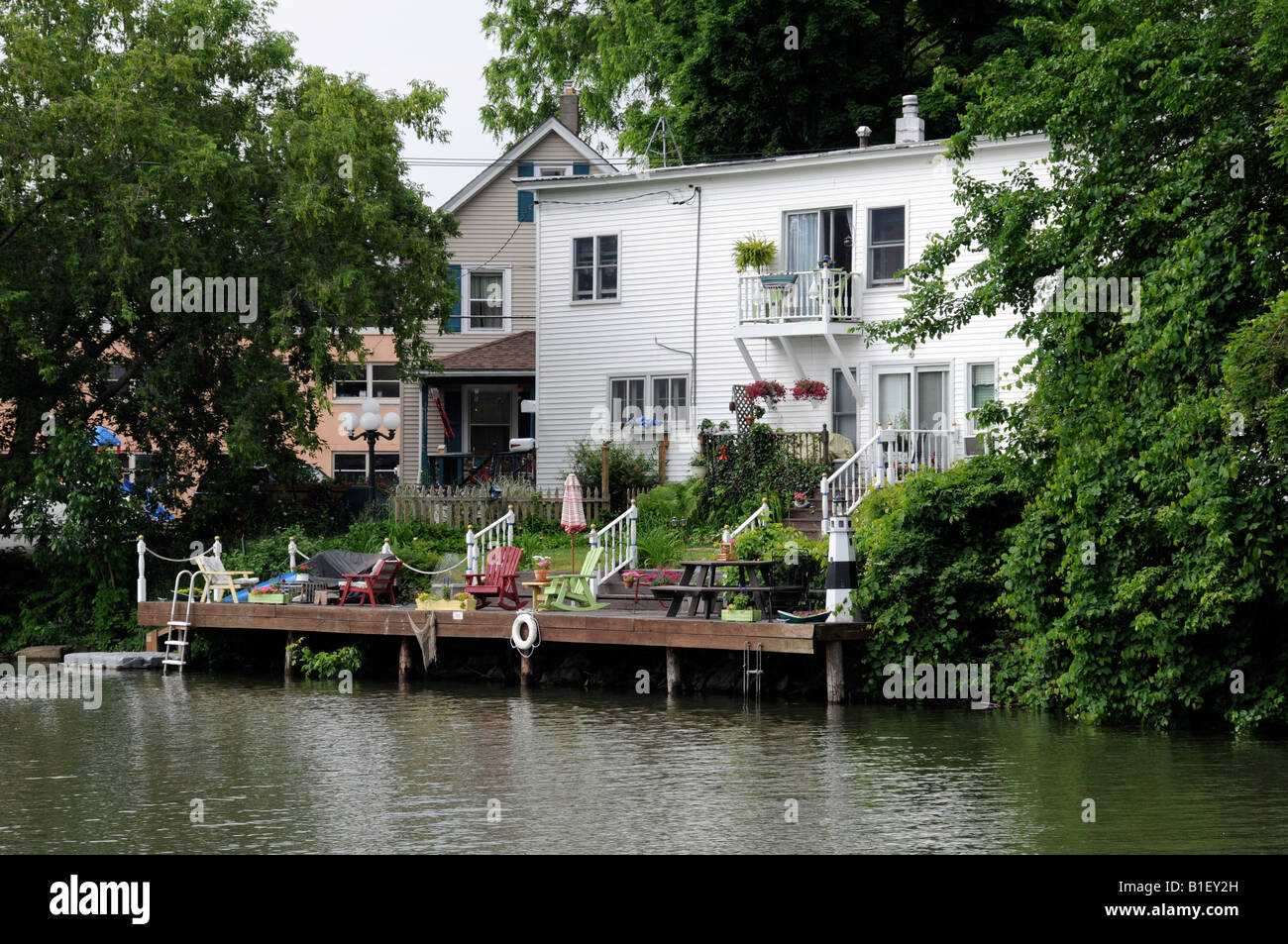 Home with dock on the Erie Canal in Fairport NY USA. Stock Photo