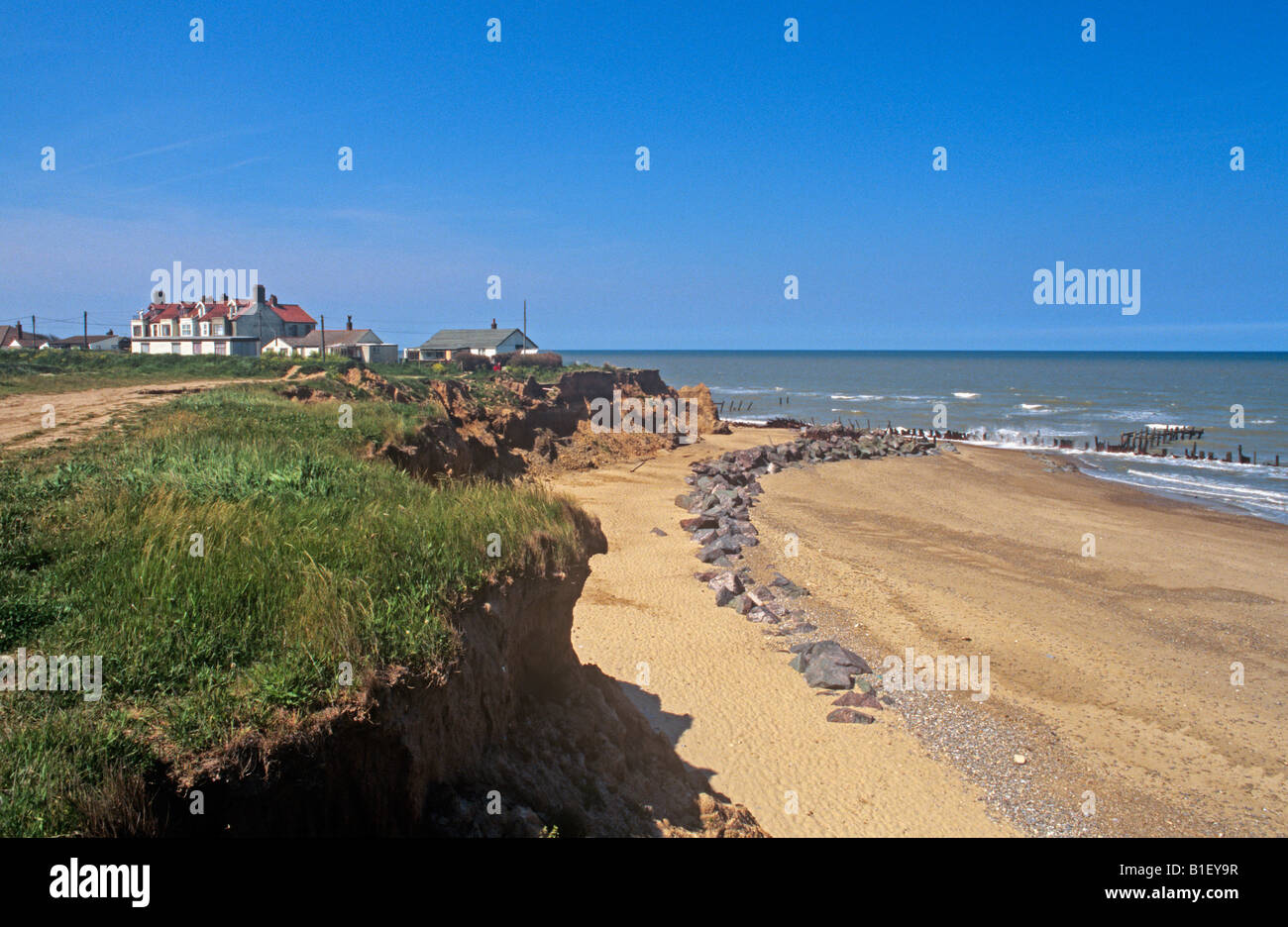 battered sea defences and recently collapsed cliffs to the south of Happisburgh on the Norfolk Coast summer 2008 Stock Photo