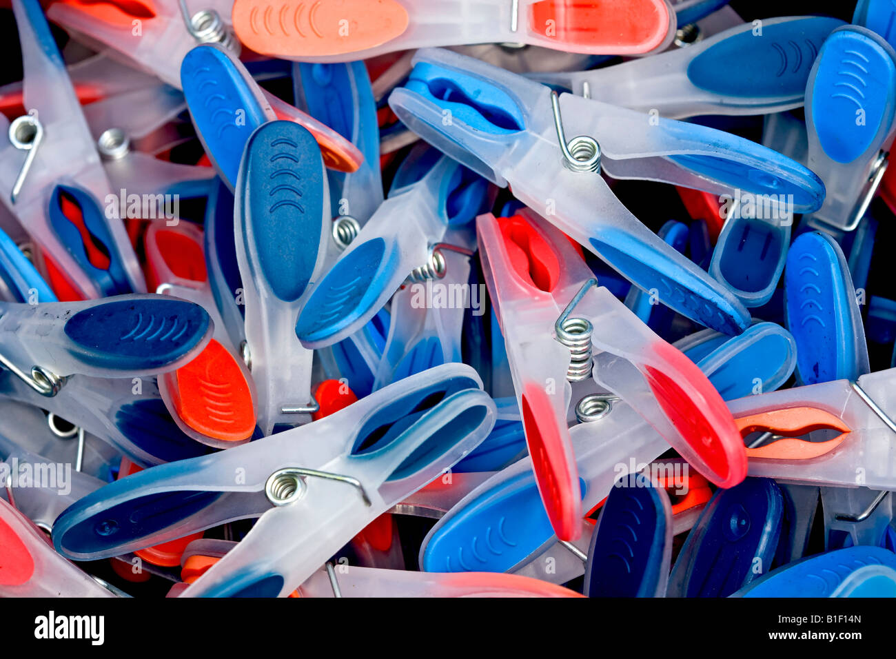 Heap of blue and red clothes pegs Stock Photo Alamy