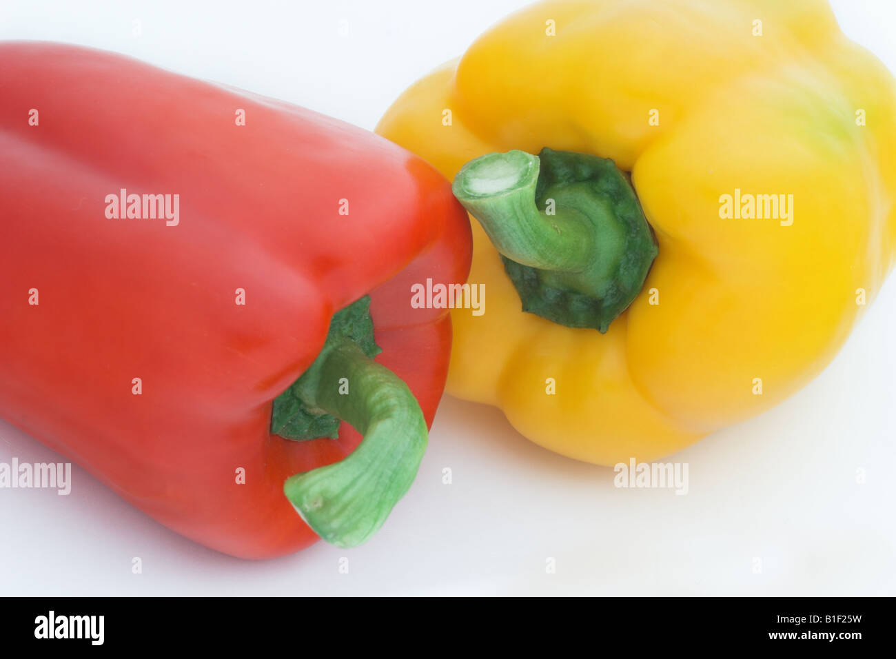 Close up of Red & Yellow Bell Peppers against a white background Stock ...