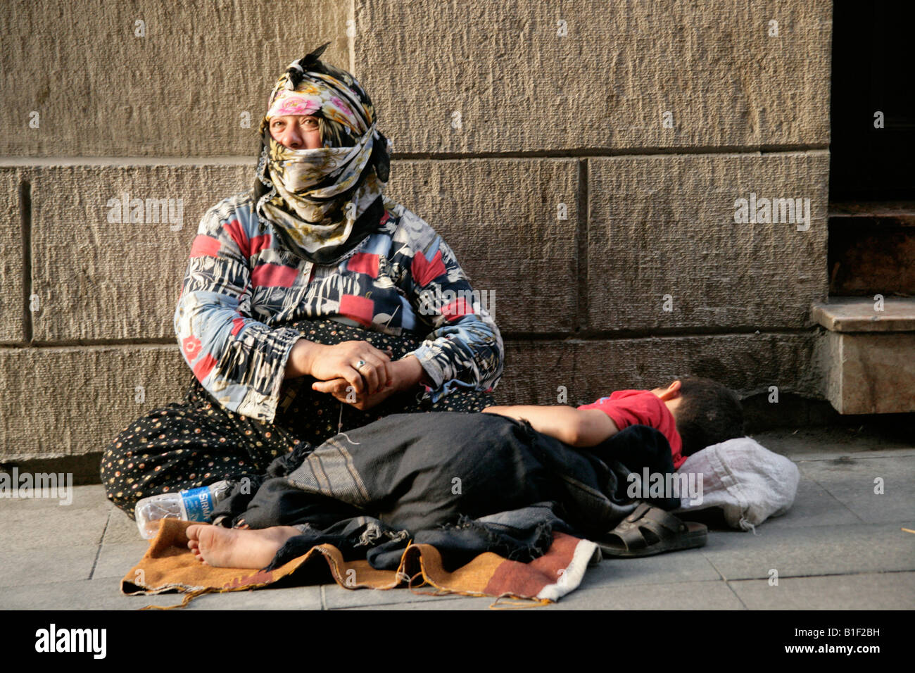 Gypsy woman begging on the streets of Istanbul, Turkey Stock Photo