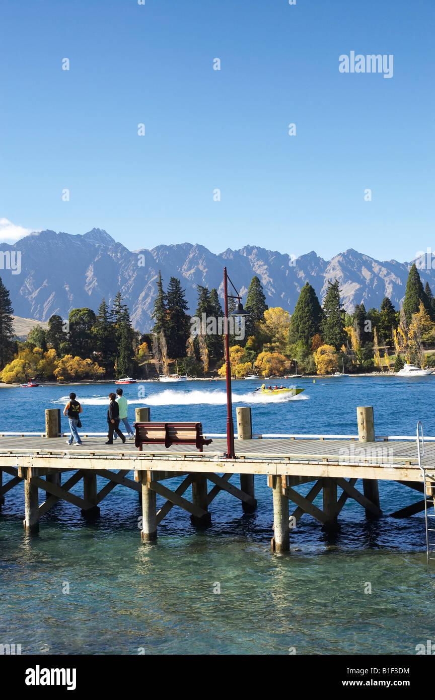 Tourists Pier Lake Wakatipu and The Remarkables Queenstown Otago South Island New Zealand Stock Photo