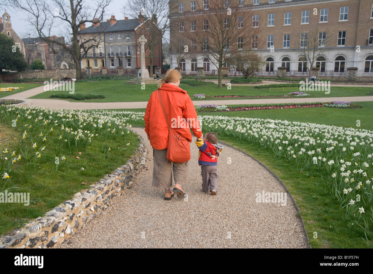 Mother with baby walking at The Forbury Gardens Reading Berkshire England UK Stock Photo