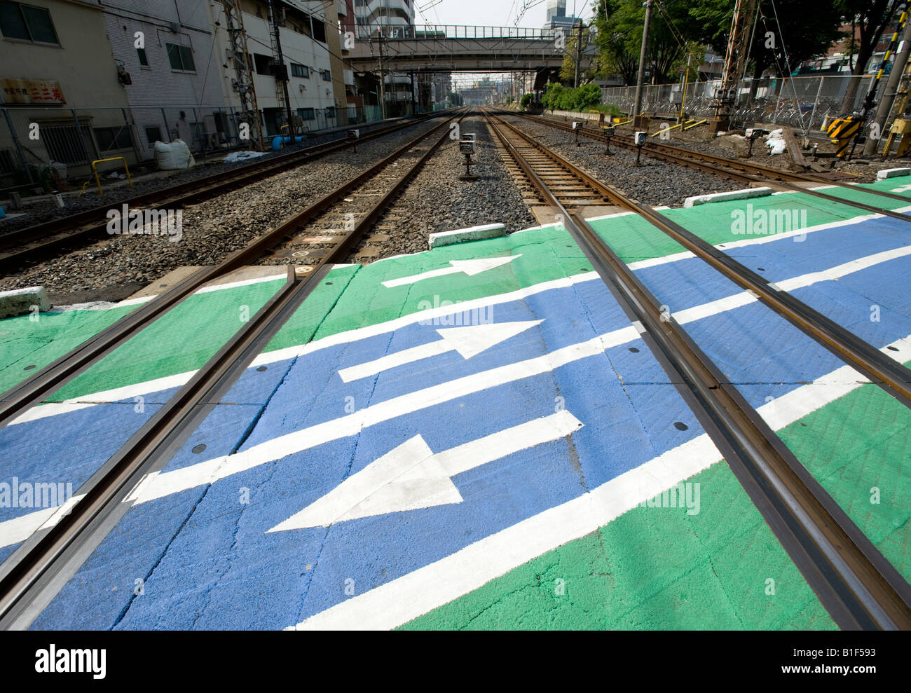 Pedestrian level crossing over commuter railway lines in central Tokyo 2008 Stock Photo