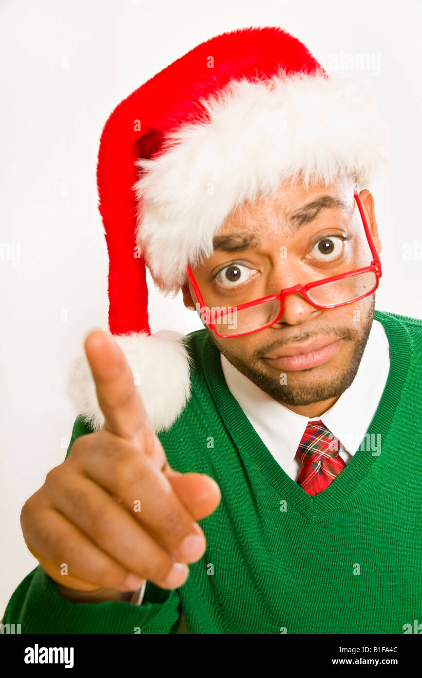 African man wearing Santa Claus hat Stock Photo