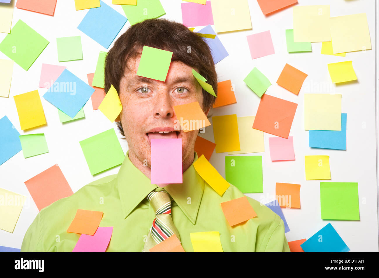 Businessman with adhesive note on forehead Stock Photo